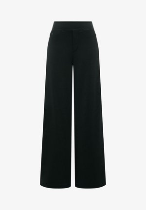 Svarte vidbukse med høyt liv, skjult frontåpning og minimalistiske detaljer.