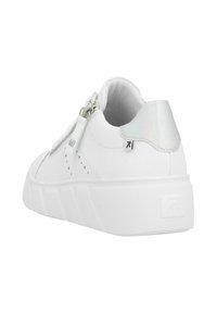 White sneaker featuring a textured surface, silver accents, and a zip closure. Thick, rubber sole with a discreet logo on the heel.