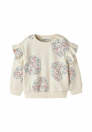 Sweat-shirt enfant à manches longues couleur crème avec patchs en forme de cœur floral et épaules à volants.
