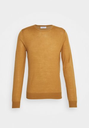 Pull jaune moutarde à manches longues et col rond, avec poignets et ourlet côtelés, présenté à plat sur un fond clair.