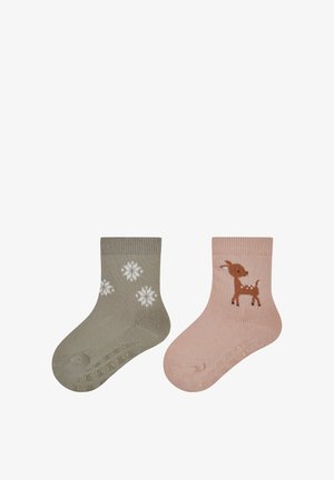 Child socks: one olive green with white snowflakes, and one pink featuring a brown reindeer; both have a ribbed cuff and textured sole.