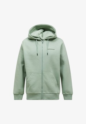 Világos zöld, cipzáras kapucnis pulóver elülső zsebekkel, húzózsinóros kapucnival, bordázott mandzsettákkal és a "Peak Performance" logóval a bal mellrészen.