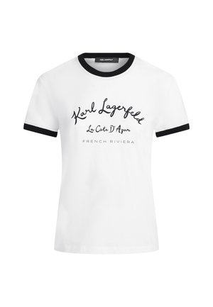 Λευκό T-shirt με κοντά μανίκια, με μαύρο γιακά και άκρες μανικιών, με το κείμενο «Karl Lagerfeld La Côte D' Azur French Riviera» στο μπροστινό μέρος.