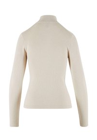 Beige ribbet genser med høy hals og lange ermer, som har en tettsittende passform og glatt tekstur. Baksiden har et sømløst design.