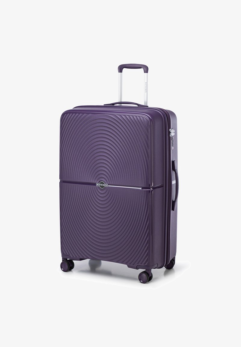 Lila Hartschalenkoffer mit kreisförmigem Texturmuster, ausziehbarem Griff und vier Rädern für Mobilität. Mit einem Logo auf der Vorderseite.