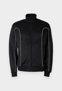 Μαύρο αθλητικό μπουφάν με φερμουάρ και όρθιο γιακά, λευκή ρίγα κατά μήκος των μανικιών και ριμπ μανσέτες. Κατασκευασμένο από απαλό, ελαστικό ύφασμα.