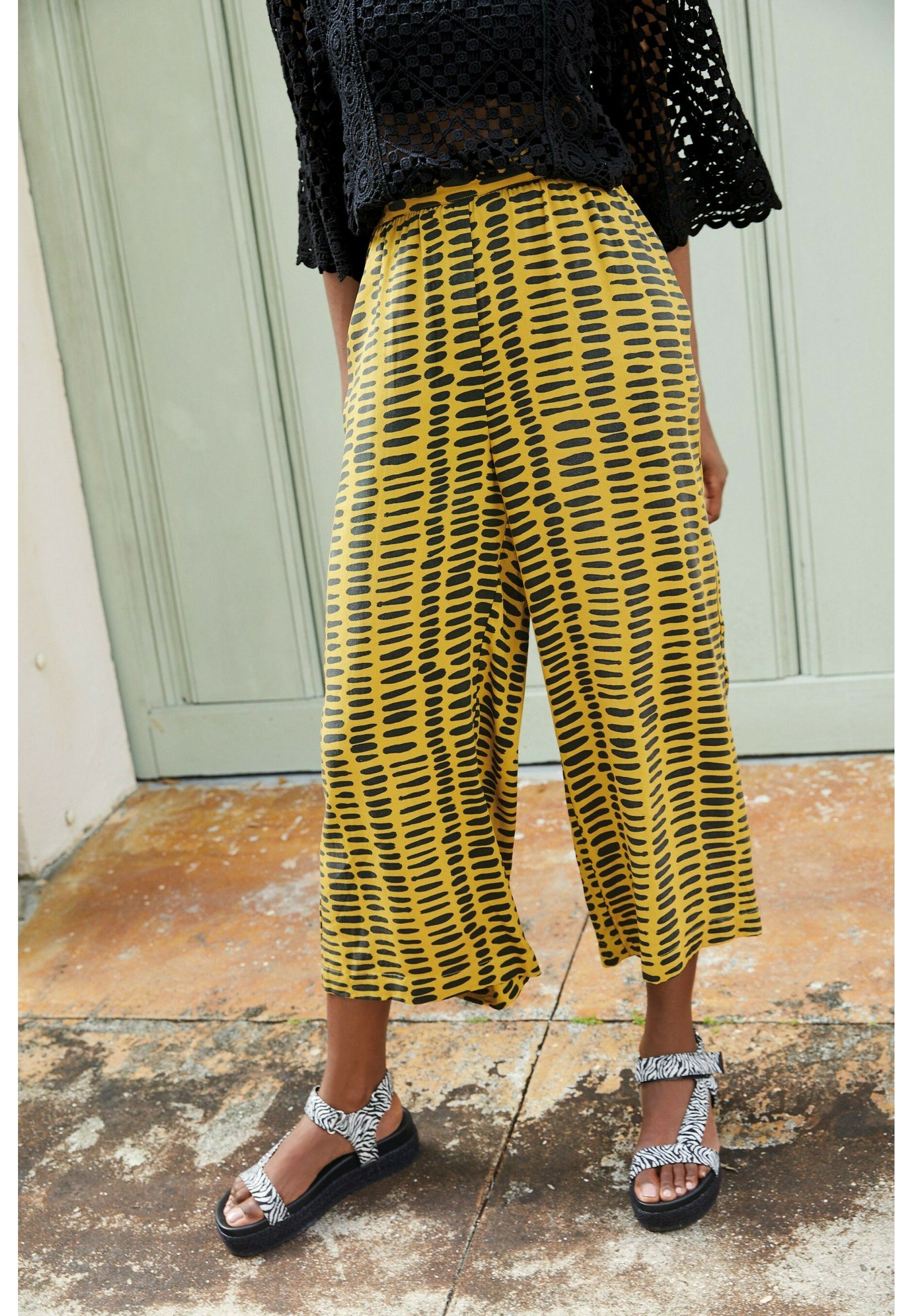 next yellow trousers