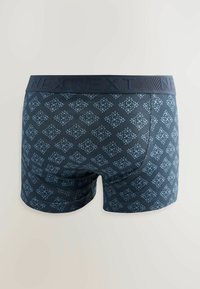 Navy blue boxer shorts with a textured, diamond pattern in light blue. Features elastic waistband with "NEXT" branding, smooth fabric.