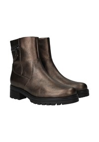 Bronze ankle boots made of textured leather with a chunky black rubber sole and side zipper detail. Classic round toe design.