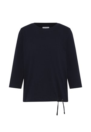 Chemise à manches longues bleu marine foncé avec un col rond et un cordon de serrage réglable au bas, sur fond blanc.