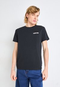 Levi's® CLASSIC GRAPHIC - Camiseta estampada - core caviar