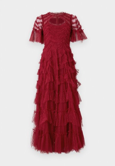 Raudona sijoninė suknelė pagaminta iš tiulio su tekstūruotu liemeniu. Savybės: trumpi rankovės, volanai ir detalė su raktų skylute nugarinėje pusėje.