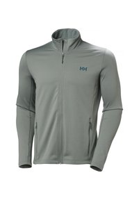 Chaqueta con cremallera de tejido gris claro con superficie texturizada; cuenta con dos bolsillos laterales y un pequeño logo azul en el lado izquierdo del pecho.