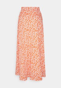 Jupe maxi florale orange avec une taille ajustée et un design fluide. Présente des marguerites blanches sur un fond vibrant. Fabriquée en tissu léger.