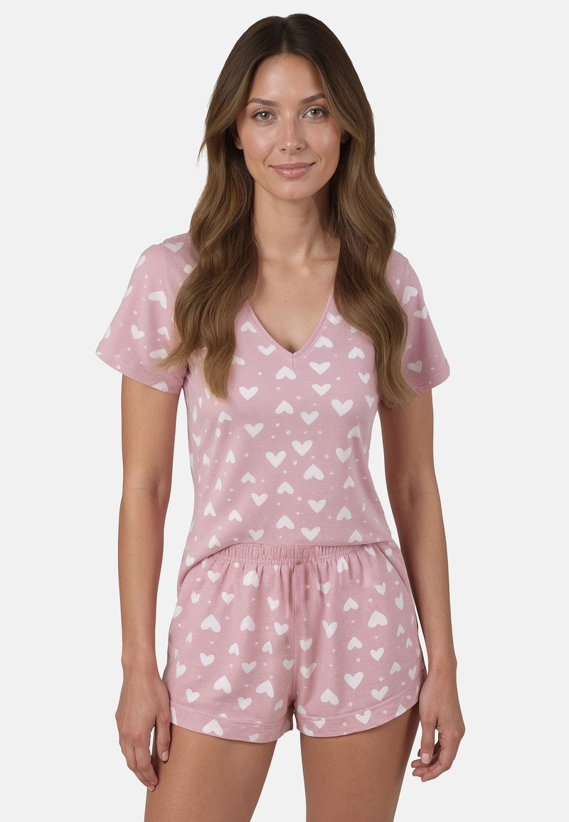 Completo pigiama rosa corto con scollatura a V, caratterizzato da una stampa a cuori e tessuto morbido. I pantaloni corti hanno un elastico in vita per garantire comfort.