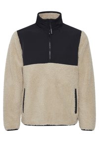 Fleece pullover with high collar, beige body, black upper panel, and side pockets. Textured surface with a soft, warm appearance.