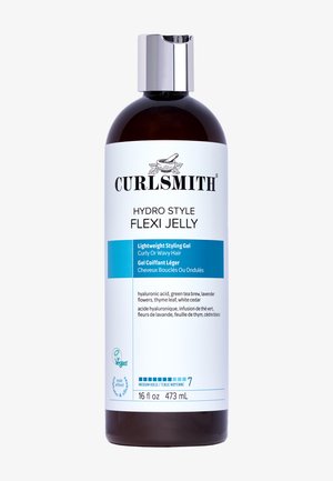 Curlsmith Hydro Style Flexi Jelly in einer klaren, bernsteinfarbenen Flasche. Das Etikett zeigt schwarzen und blauen Text, weiße Akzente und einen silbernen Deckel. 473 ml.
