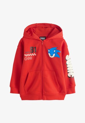 Czerwona bluza z kapturem na zamek, z twarzą Sonic the Hedgehog na piersi, numerem 91 i grafiką w stylu wyścigowym z przodu oraz tekstem Sonic na rękawie.