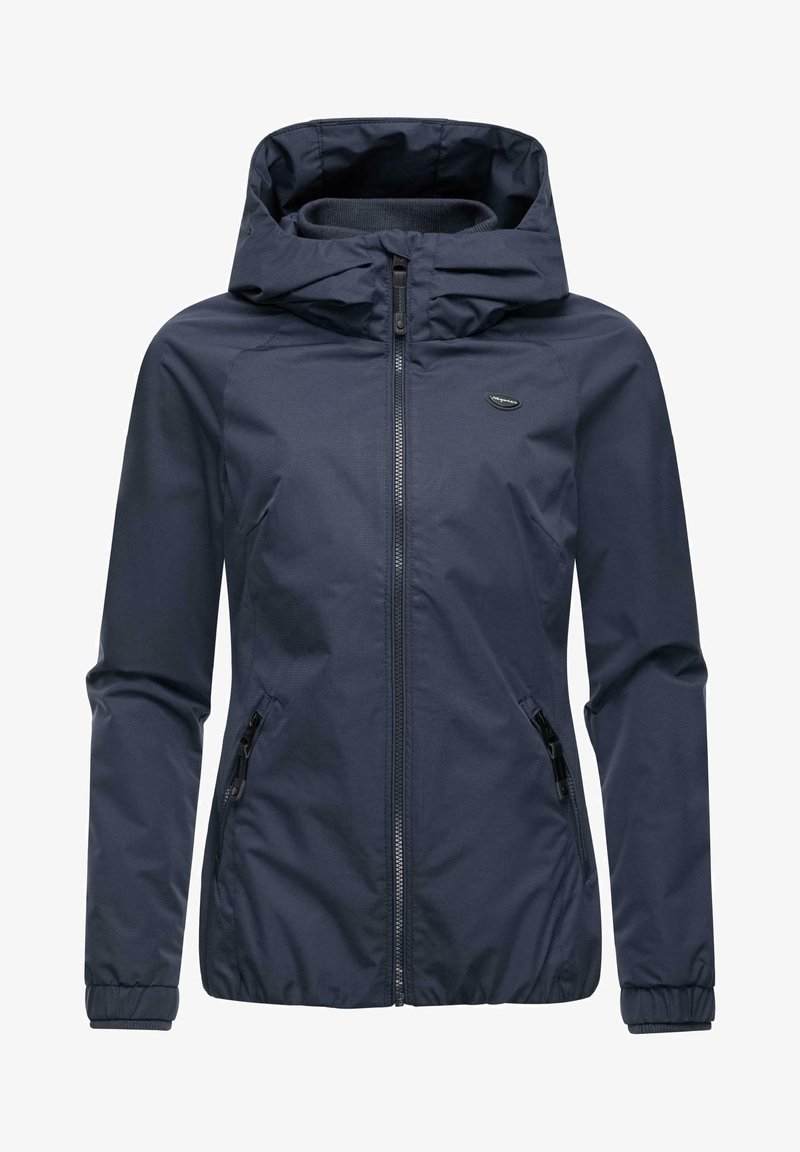 Tamsiai mėlyna vandeniui atsparus džemperis su gobtuvu, priekiniais užtrauktuko uždarymu, elastingomis rankovėmis ir dviem šoniniais užtrauktuko kišenėmis. Lygi tekstūra, minimalistinis dizainas.