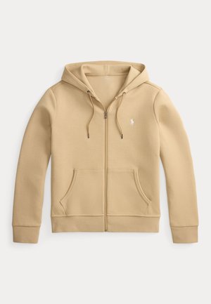 Beige full-zip hoodie with front pockets, drawstring hood, and small white embroidered polo player logo on the left chest.