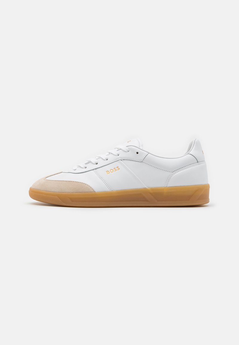 White sneakers with a smooth leather upper, suede toe cap, and a gum rubber sole. Features branding on the side and textured accents.