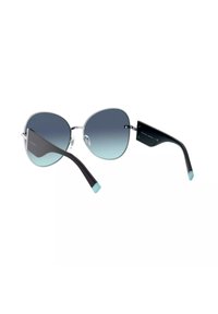 Occhiali da sole over-size a forma di farfalla con lenti grigie sfumate, montatura nera e punte turchesi sulle aste. Inclusi dettagli in metallo.
