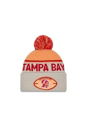 Knit beanie in orange and gray with a red pom-pom. Features "TAMPA BAY" text and a football-shaped logo with a team mascot graphic.