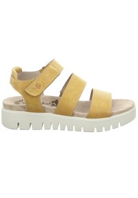 Yellow leather sandal with three wide straps, soft suede footbed, and chunky white sole with a notched pattern. Adjustable ankle strap.