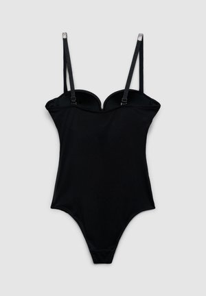 Body nero intero con spalline sottili regolabili e dettagli in strass su uno sfondo grigio chiaro uniforme.