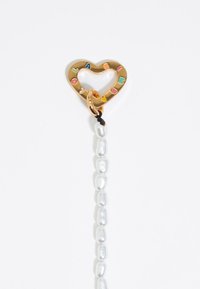 Gold heart-shaped charm with colorful letters, connected to a strand of irregularly shaped white pearls, featuring a black accent.