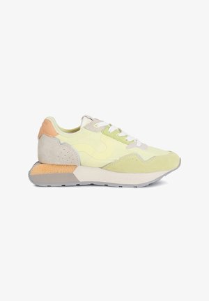 Sneakers featuring a mix of pastel yellow, grey, and beige suede, with white laces and a textured orange heel accent.