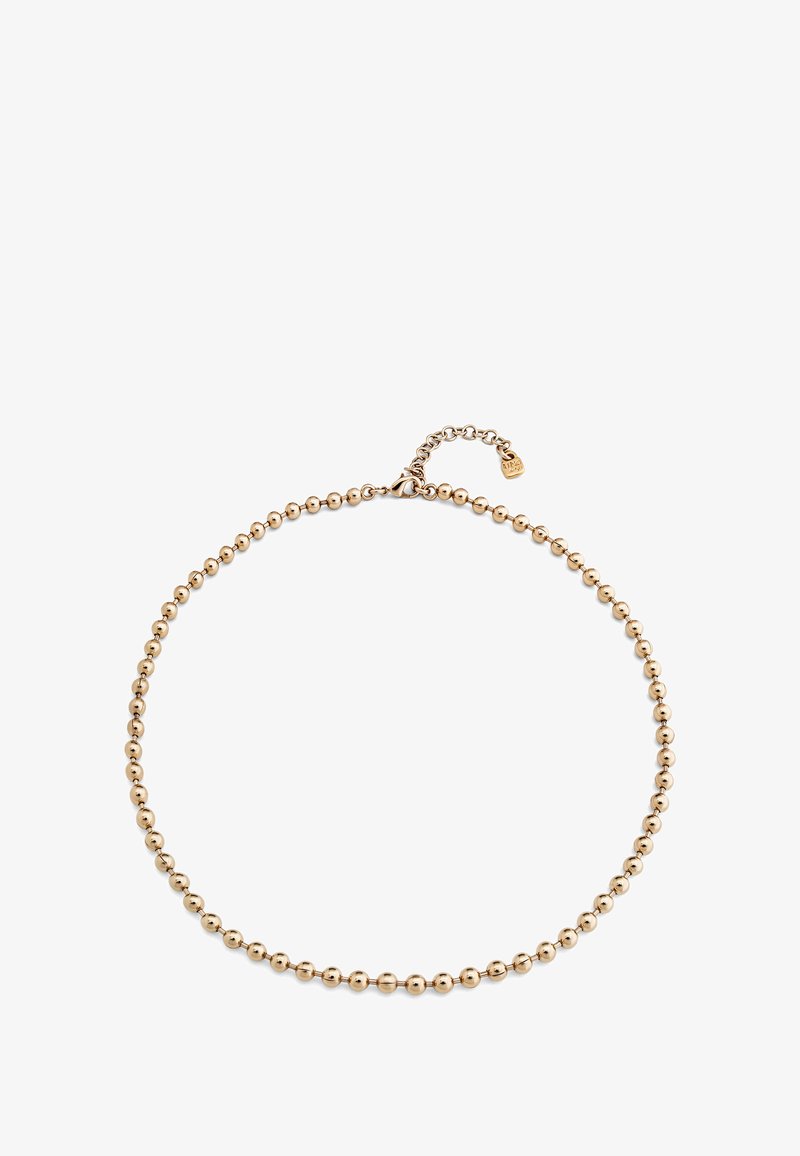 Collar de cuentas doradas con cuentas redondas uniformes, que cuenta con un extensor de cadena para longitud ajustable y un pequeño acento de etiqueta.