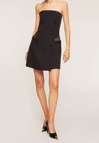 Black strapless dress with a fitted bodice, six decorative buttons, two side pockets, and a smooth fabric texture.