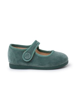 Green suede Mary Jane shoe with a rounded toe and adjustable strap, featuring a round button accent and textured trim along the edges.