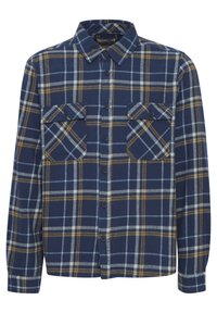Camisa de franela azul marino con patrón de cuadros en amarillo y azul claro. Cuenta con dos bolsillos en el pecho y un cierre de botones en la parte delantera con mangas largas.