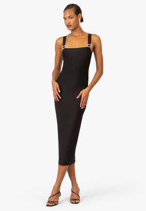 Black midi dress with square neckline, embellished straps, and fitted silhouette. Smooth fabric with a sleek, minimalistic design.