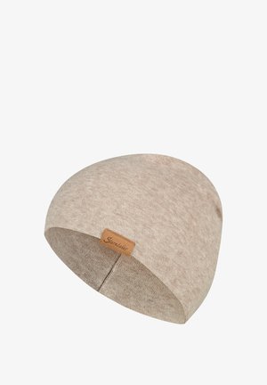 Beige gestrickte Mütze mit einem kleinen braunen Lederetikett mit der Aufschrift "Sterntaler" an der Seite.