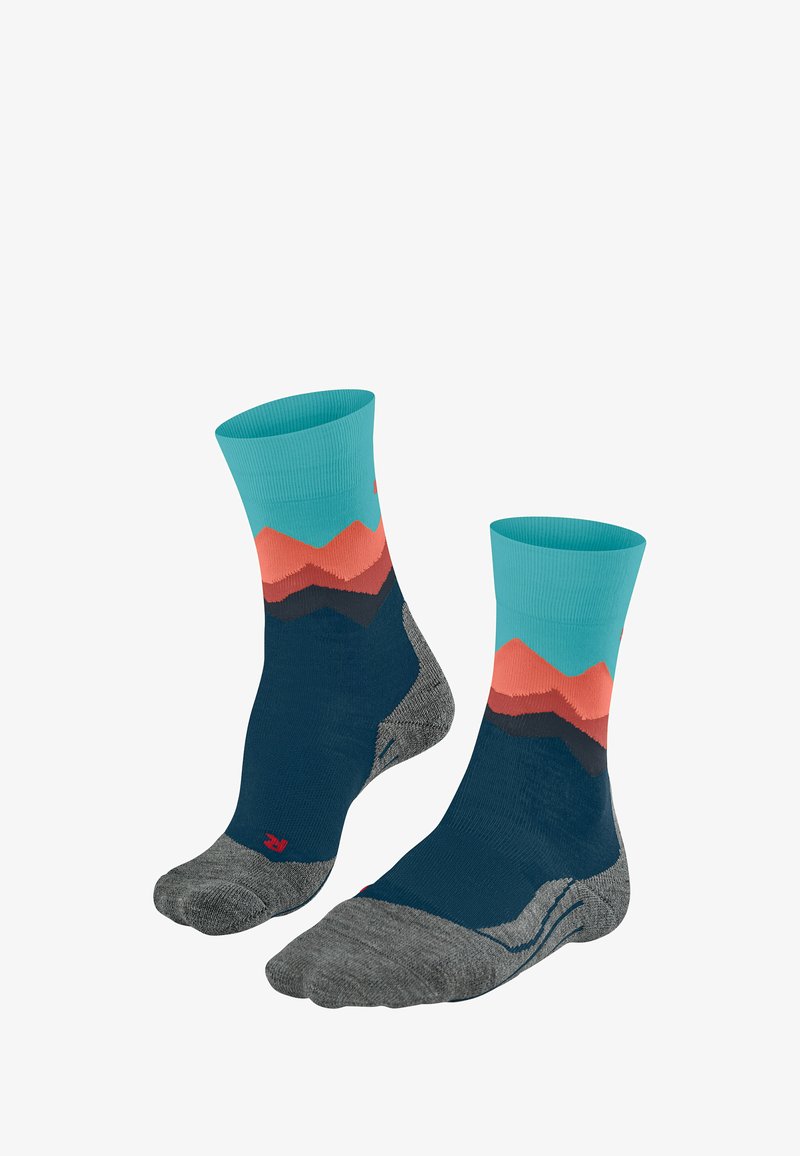 Bunte Wandersocken mit einem türkisen Bund, einem geschichteten Bergdesign in Orange und Marineblau sowie einer grauen strukturierten Sohle.