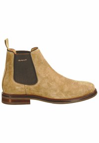 Tanfarbene Wildleder-Ankle-Boots mit elastischen seitlichen Einsätzen, gesteppten Details und einem niedrigen, gestapelten Holzabsatz. Mit dem GANT-Logo an der Seite.