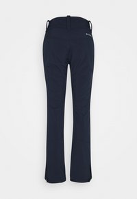 Marinblå skidbyxor med en figurnära design, tillverkade av ett hållbart och elastiskt material. Har blixtlås på sidorna och en midja med öglor för extra st öd.