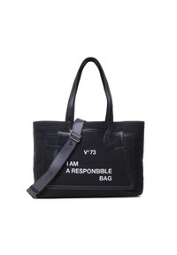 Sac en toile noir avec des accents en cuir, affichant le texte "JE SUIS UN SAC RESPONSABLE" en blanc, avec des poignées doubles et une sangle ajustable.