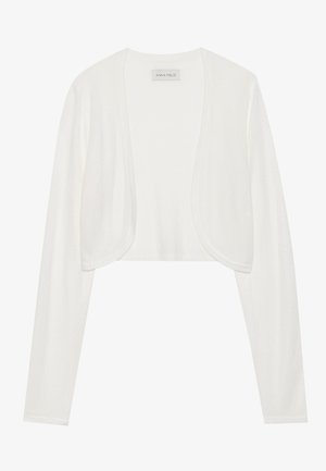 White cropped cardigan, long sleeves, soft knit texture, open front design, label reads "ANNA FIELD," minimalistic style with no fasteners.