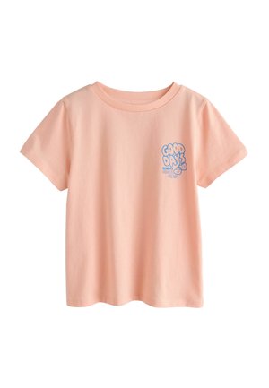 Lyse ferskenfarvet bomuld T-shirt med korte ærmer, rund hals og blå tekstgrafik med ordene "GOOD DAYS ALWAYS" på brystet.