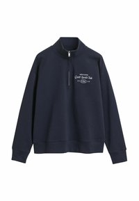 Marineblauwe sweater met een kwart ritssluiting en de tekst "New Haven Gant Sports Club 1949 USA" in het wit gedrukt op de linkerborst.