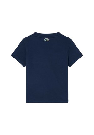 Maglietta a maniche corte blu navy con un piccolo logo coccodrillo verde e bianco posizionato centralmente sotto la nuca sul retro.