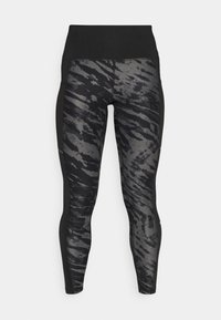 Czarno-szare legginsy w wzory z wysokim stanem, charakteryzujące się smukłym krojem oraz teksturowanym materiałem o subtelnej połysku.