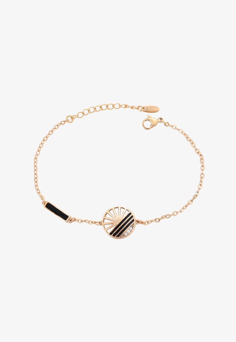 Rozā zeltā veidota aproce ar apaļu piekari, kuram ir melnas un zelta svītras un trīs mazi caurspīdīgi akmeņi. Iekļauta omāra aizdare.