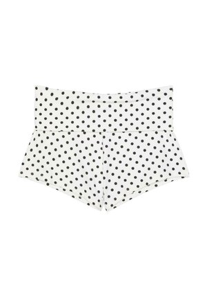 Short blanc taille haute à pois noirs, avec une large ceinture pliée et une coupe ajustée.