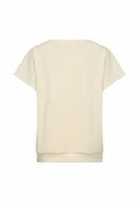 Light beige short-sleeve top with a rounded neckline, relaxed fit, and soft texture; features a hem band for structure.