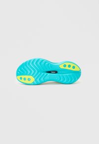 La semelle de chaussure présente un motif ondulé en turquoise avec des accents jaunes ; marquée avec "saucony" et "speedroll" sur la surface.